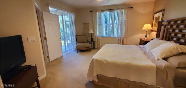 bedroom featuring light colored carpet