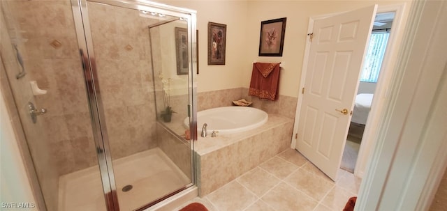 bathroom featuring independent shower and bath and tile patterned flooring