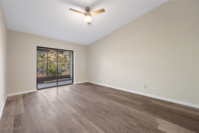 spare room featuring hardwood / wood-style flooring, lofted ceiling, and ceiling fan