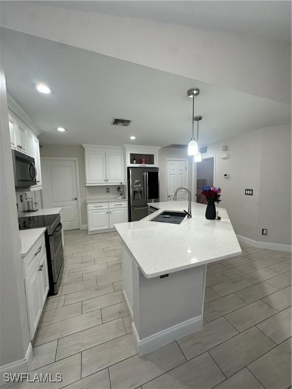 kitchen with an island with sink, black electric range oven, stainless steel fridge with ice dispenser, and white cabinets