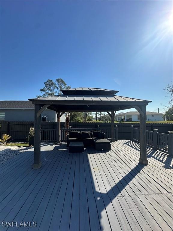 wooden terrace with a gazebo