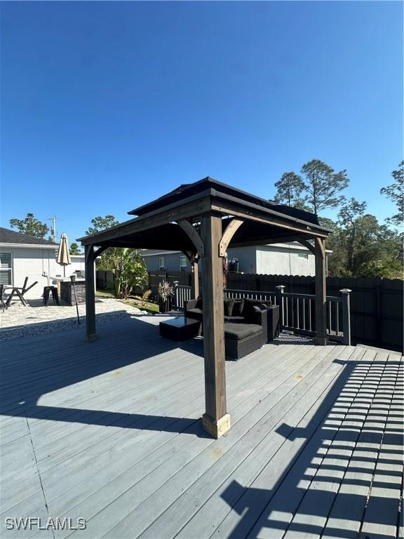 wooden deck with a gazebo