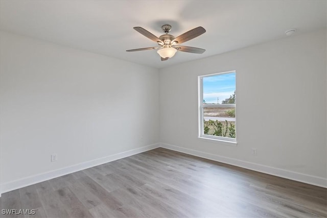 unfurnished room with ceiling fan and light wood-type flooring