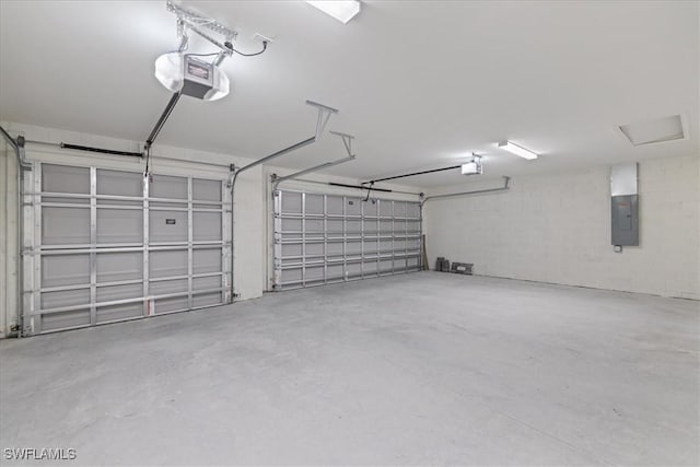 garage featuring a garage door opener and electric panel