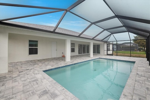 view of pool featuring a lanai and a patio area