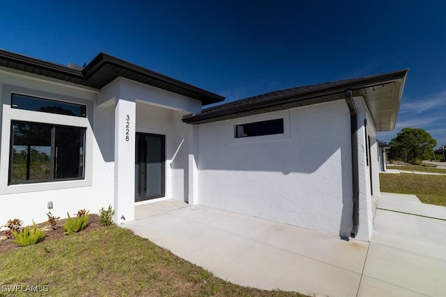 exterior space featuring a yard and a patio