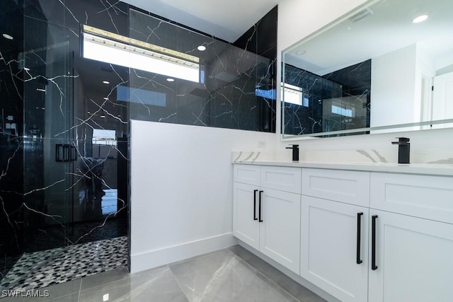 bathroom featuring vanity and a tile shower