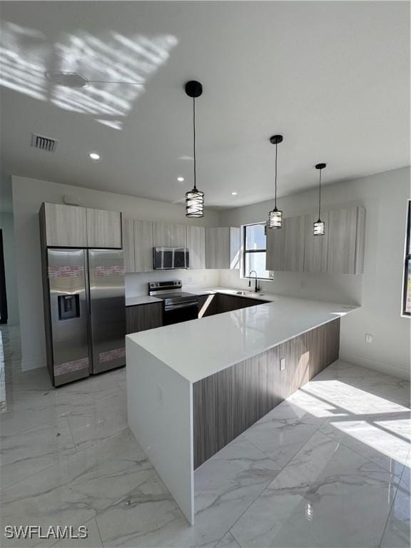 kitchen with a peninsula, stainless steel appliances, light countertops, modern cabinets, and marble finish floor