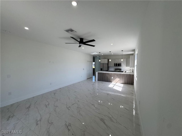 unfurnished living room featuring a ceiling fan, visible vents, baseboards, recessed lighting, and marble finish floor