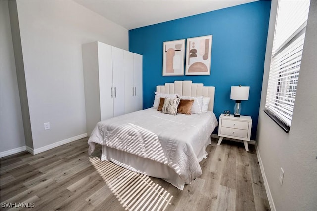 bedroom with light hardwood / wood-style floors