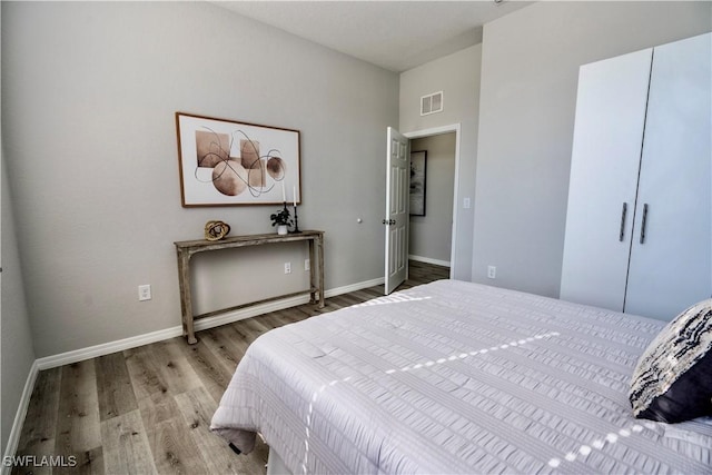 bedroom featuring hardwood / wood-style floors