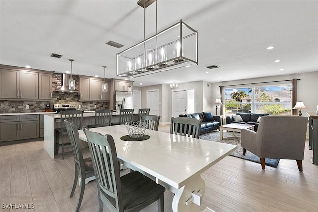 dining space featuring light hardwood / wood-style floors