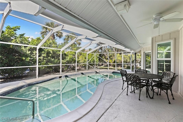 view of pool featuring a patio and glass enclosure