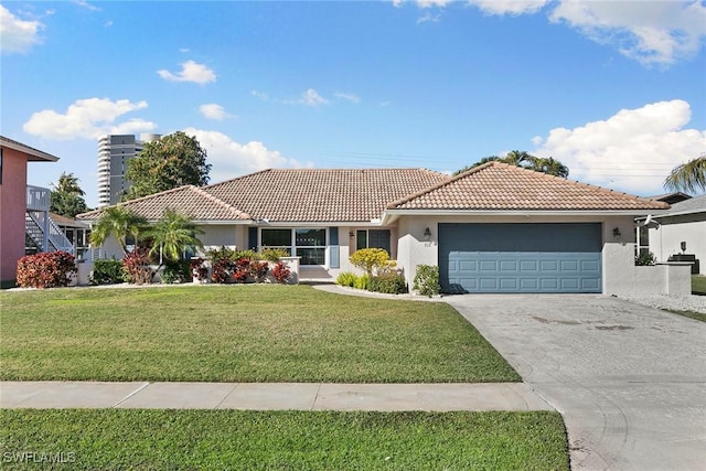 view of front of house featuring a garage and a front lawn