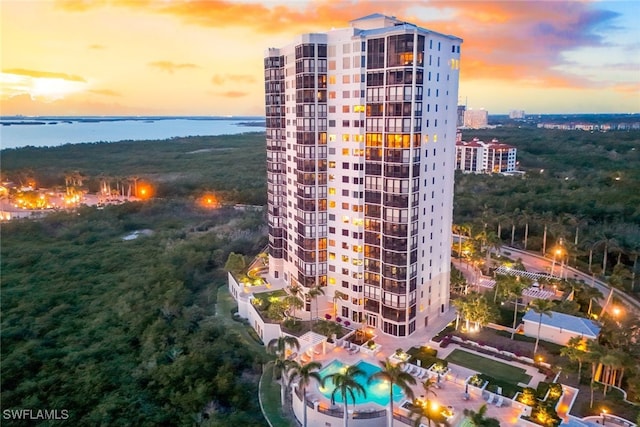 outdoor building at dusk featuring a water view