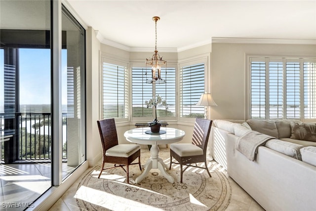 dining space featuring a chandelier and ornamental molding