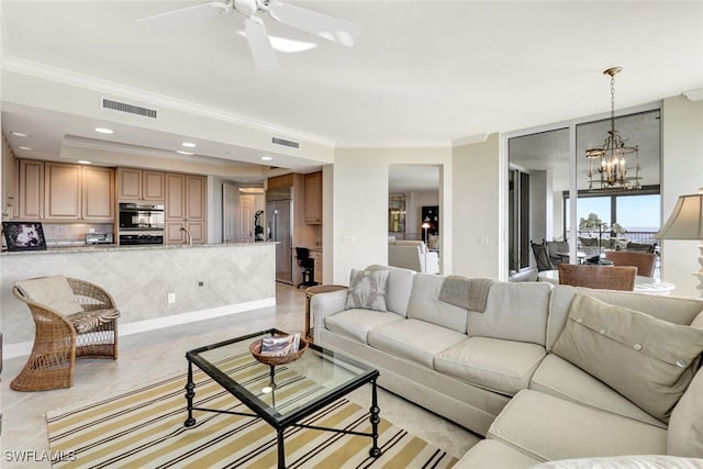 living room featuring recessed lighting, visible vents, ceiling fan with notable chandelier, and ornamental molding