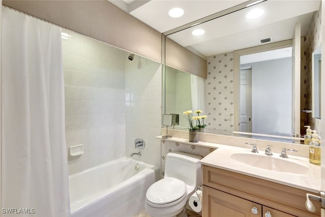 full bathroom with vanity, wallpapered walls, recessed lighting, toilet, and shower / tub combo with curtain