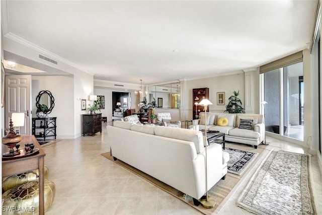 tiled living room with ornamental molding and a chandelier