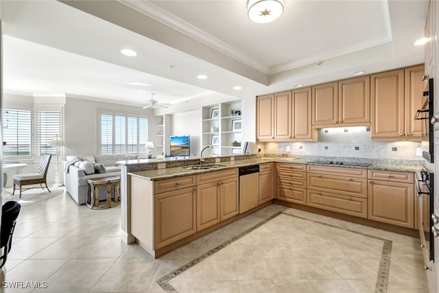 kitchen with a tray ceiling, recessed lighting, a sink, stainless steel dishwasher, and crown molding