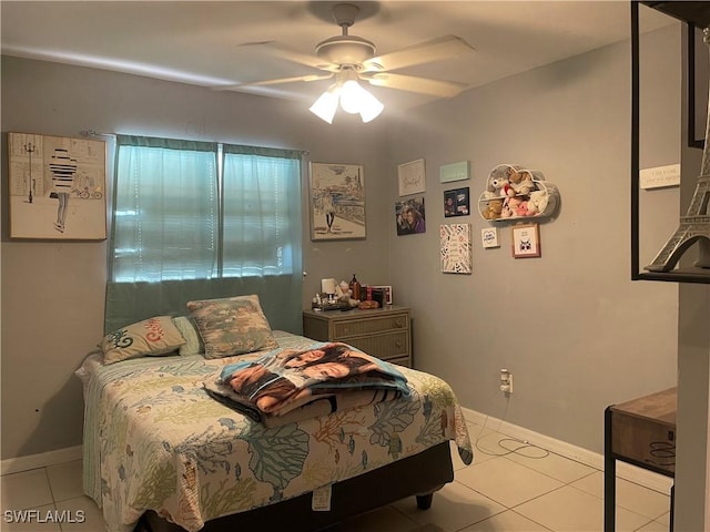 bedroom with ceiling fan and light tile patterned flooring