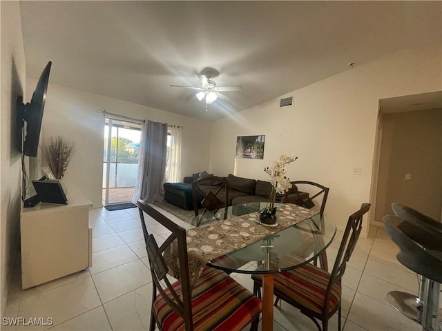 dining space featuring light tile patterned floors and ceiling fan