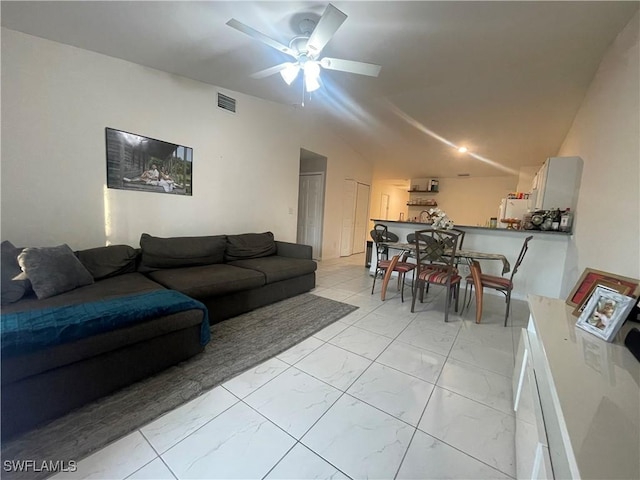 living room featuring lofted ceiling and ceiling fan