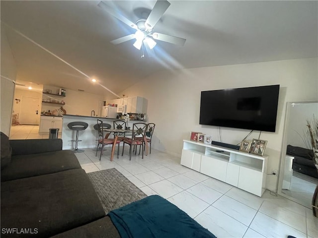 tiled living room with vaulted ceiling and ceiling fan