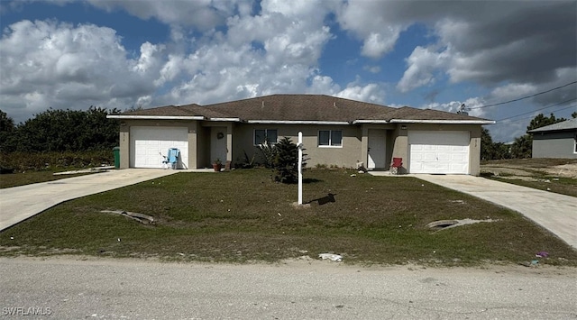 ranch-style home with a garage and a front yard