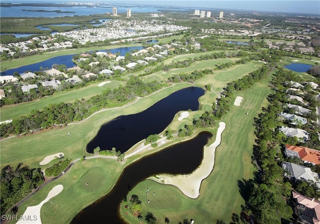 aerial view featuring golf course view and a water view