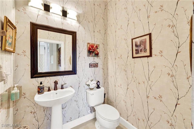 bathroom featuring sink and toilet