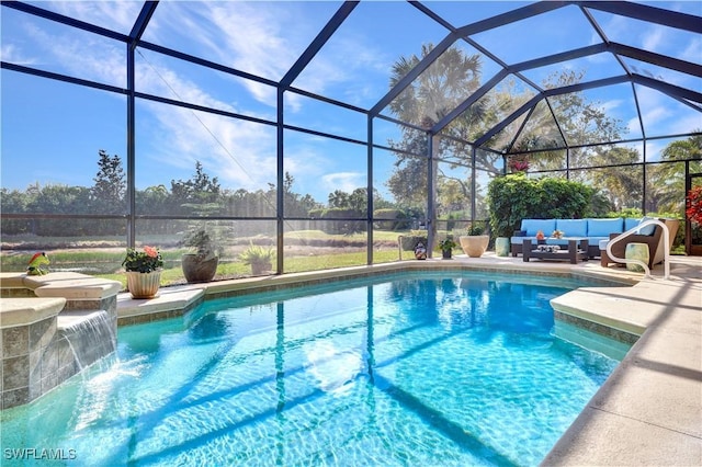 view of pool featuring pool water feature, an outdoor hangout area, a patio area, and glass enclosure