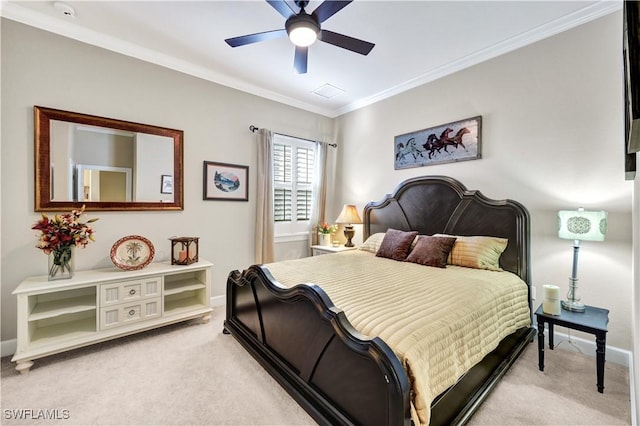 carpeted bedroom featuring crown molding and ceiling fan