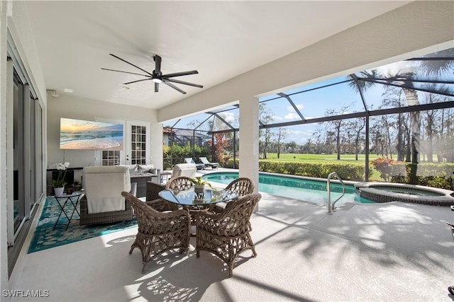 view of patio with a swimming pool with hot tub, outdoor lounge area, and a lanai