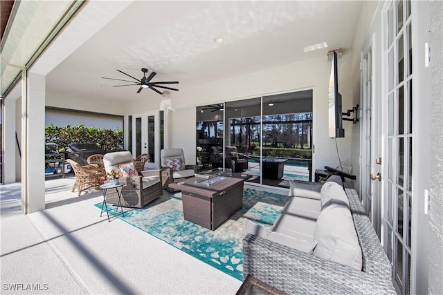 living room with ceiling fan and french doors