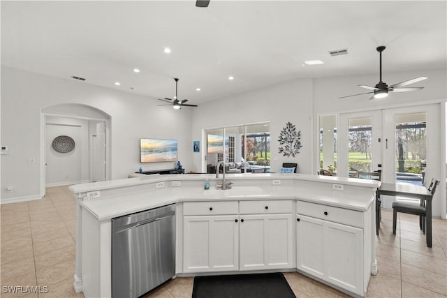 kitchen with white cabinetry, sink, stainless steel dishwasher, light tile patterned floors, and ceiling fan