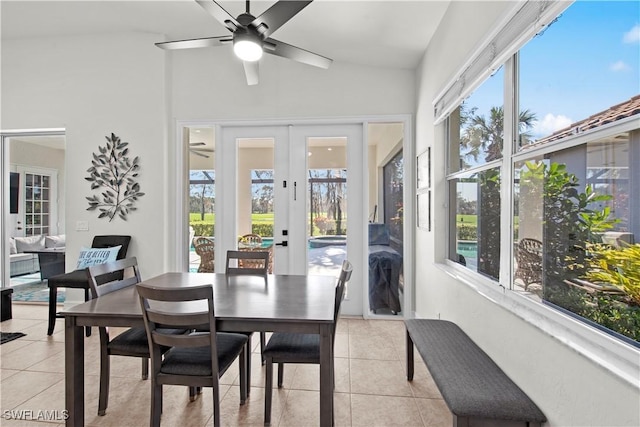 dining space with french doors, light tile patterned flooring, and a wealth of natural light