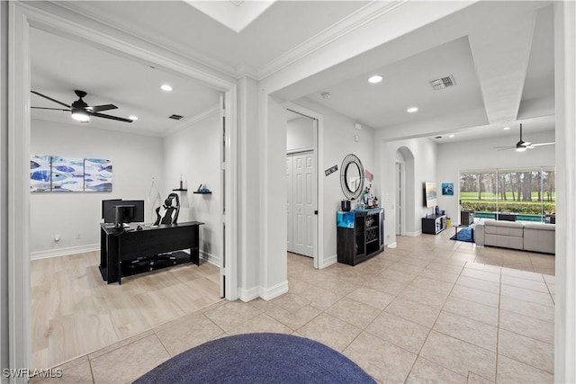 interior space with crown molding and light tile patterned flooring