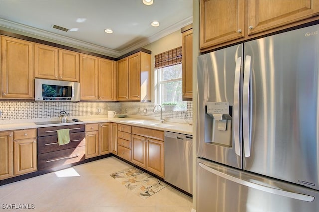 kitchen with sink, crown molding, light tile patterned floors, stainless steel appliances, and tasteful backsplash