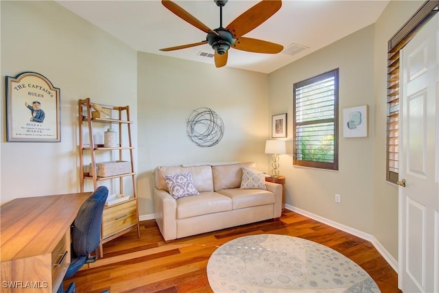 living room with hardwood / wood-style flooring and ceiling fan