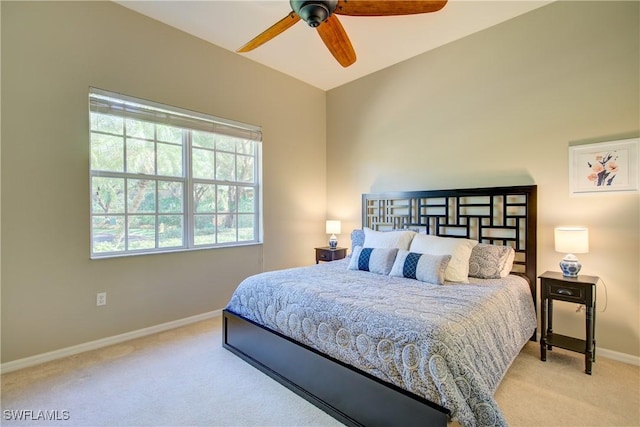 bedroom with ceiling fan and light carpet