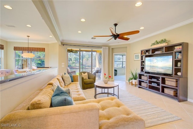 tiled living room with ornamental molding, a wealth of natural light, and ceiling fan