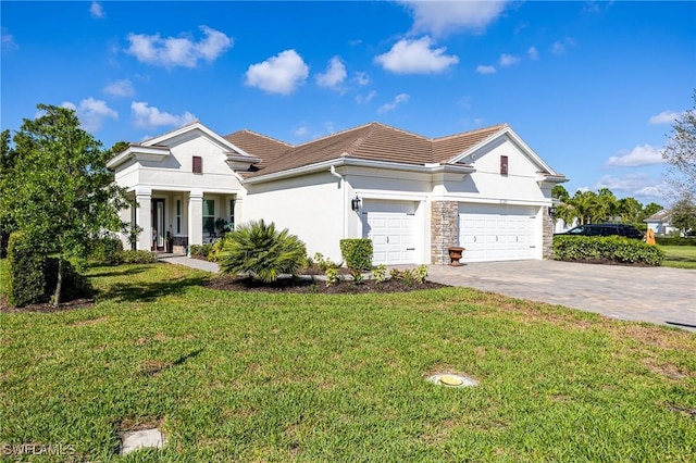 view of front of home featuring a garage and a front lawn