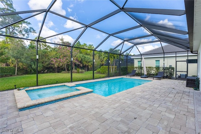 view of swimming pool with a yard, a lanai, a patio area, and a pool with connected hot tub