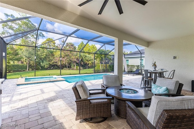 view of patio with a pool with connected hot tub, glass enclosure, and ceiling fan