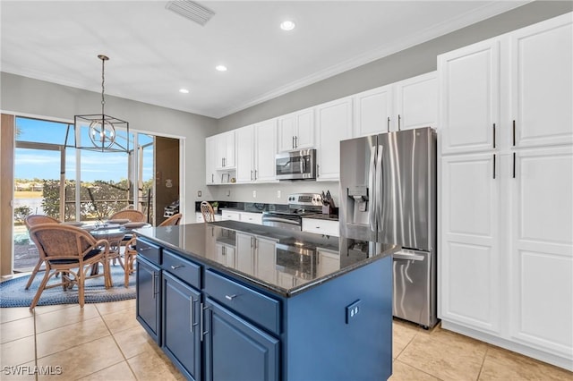 kitchen with blue cabinetry, white cabinetry, hanging light fixtures, stainless steel appliances, and a center island