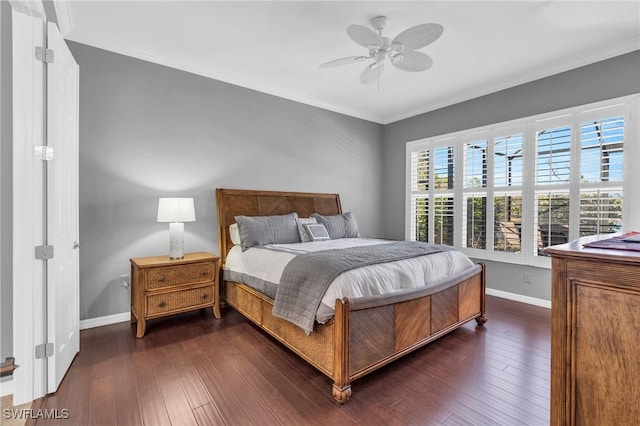 bedroom with crown molding, dark wood-type flooring, and ceiling fan