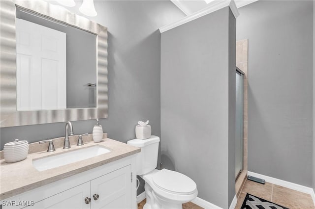 bathroom with a shower with door, vanity, tile patterned flooring, and toilet