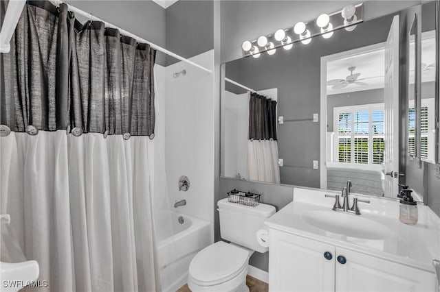 full bathroom with ceiling fan, vanity, toilet, and shower / tub combo