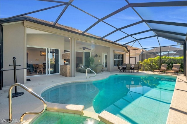 view of swimming pool with a lanai, a patio, and ceiling fan